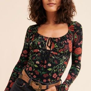 “Make it Easy” black floral tie front Free People long sleeve top size medium
